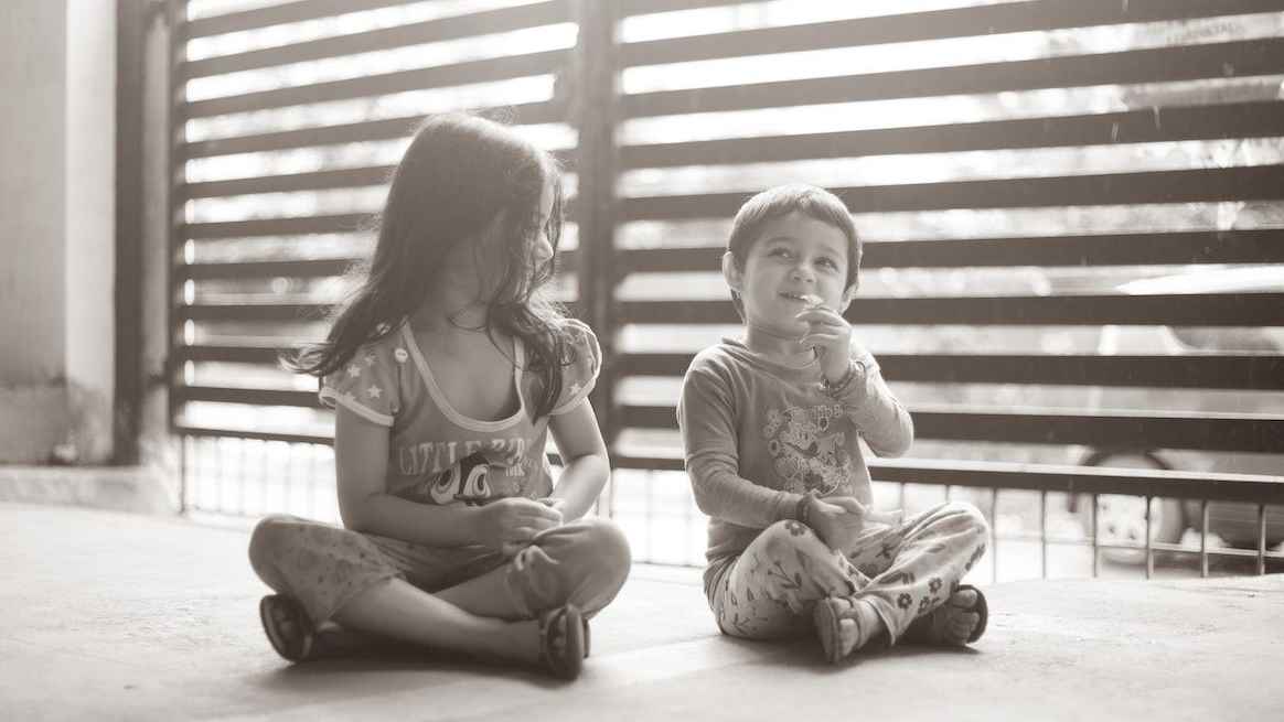 a little boy and girl playing